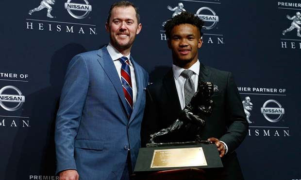 Kyler Murray and head coach Lincoln Riley of the Oklahoma Sooners poses for a photo after winning t...