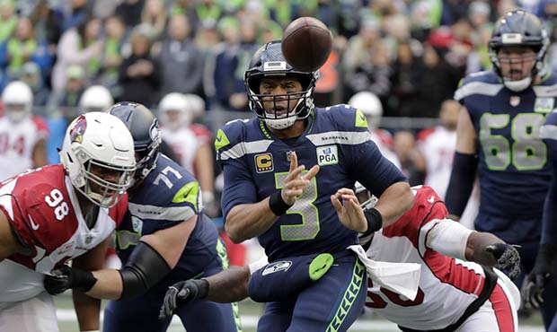 Seattle Seahawks quarterback Russell Wilson (3) passes against the Arizona Cardinals during the fir...