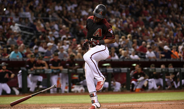 Jarrod Dyson #1 of the Arizona Diamondbacks is hit by a pitch during the seventh inning of the MLB ...