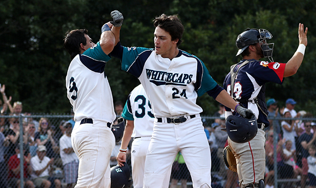 Hunter Bishop, right, celebrates with Michael Gasper of the Brewster Whitecaps during game one of t...