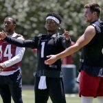 Arizona Cardinals' Kyler Murray (1), Drew Anderson (3) and Damiere Byrd (14) stretch during an NFL football practice, Wednesday, May 29, 2019, in Tempe, Ariz. (AP Photo/Matt York)