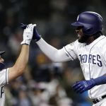 San Diego Padres' Franmil Reyes, right, celebrates with teammate Eric Hosmer, left, after hitting a two-run home run during the sixth inning of a baseball game against the Arizona Diamondbacks, Monday, May 20, 2019, in San Diego. (AP Photo/Gregory Bull)