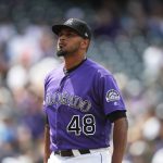 Colorado Rockies starting pitcher German Marquez heads to the dugout after giving up two runs to the Arizona Diamondbacks in the third inning of a baseball game Sunday, May 5, 2019, in Denver. (AP Photo/David Zalubowski)