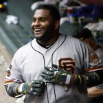 San Francisco Giants' Pablo Sandoval smiles in the dugout after hitting a pinch-hit home run against the Arizona Diamondbacks during the 10th inning of a baseball game, Sunday, May 19, 2019, in Phoenix. (AP Photo/Ralph Freso)