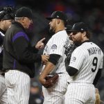 Colorado Rockies manager Bud Black, second from left, confers with starting pitcher Antonio Senzatela after he walked Arizona Diamondbacks' Alex Avila in the sixth inning of a baseball game, Tuesday, May 28, 2019, in Denver. (AP Photo/David Zalubowski)