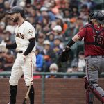 San Francisco Giants' Steven Duggar, left, reacts after striking out against the Arizona Diamondbacks during the fifth inning of a baseball game in San Francisco, Sunday, May 26, 2019. (AP Photo/Tony Avelar)