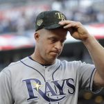 Tampa Bay Rays' Erik Katz puts on his hat before the team's baseball game against the New York Yankees on Friday, May 17, 2019, in New York. (AP Photo/Frank Franklin II)