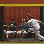 Pittsburgh Pirates right fielder Melky Cabrera tries to chase down a two-run triple hit by Arizona Diamondbacks' Eduardo Escobar during the second inning of a baseball game Monday, May 13, 2019, in Phoenix. (AP Photo/Ross D. Franklin)