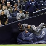 Arizona Diamondbacks left fielder David Peralta runs into a rolled mat after making a catch for the out on San Diego Padres' Eric Hosmer during the fourth inning of a baseball game Monday, May 20, 2019, in San Diego. (AP Photo/Gregory Bull)