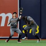 Arizona Diamondbacks left fielder Tim Locastro (16) avoids colliding with center fielder Ketel Marte after catching a fly-out by Tampa Bay Rays' Kevin Kiermaier during the third inning of a baseball game Monday, May 6, 2019, in St. Petersburg, Fla. (AP Photo/Chris O'Meara)