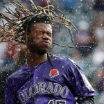 Colorado Rockies' Raimel Tapia shakes his head after being doused in celebration of his walk-off single off Arizona Diamondbacks relief pitcher Matt Andriese in the 11th inning of a baseball game, Monday, May 27, 2019, in Denver. The Rockies won 4-3. (AP Photo/David Zalubowski)