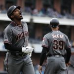 Arizona Diamondbacks' Adam Jones, left, reacts after flying out during the ninth inning of the team's baseball game against the San Diego Padres, Wednesday, May 22, 2019, in San Diego. (AP Photo/Gregory Bull)