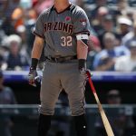 Arizona Diamondbacks pinch-hitter Kevin Cron reacts after being called out on strikes while facing Colorado Rockies relief pitcher Jairo Diaz in the seventh inning of a baseball game Monday, May 27, 2019, in Denver. (AP Photo/David Zalubowski)