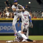 New York Mets' Amed Rosario forces out Arizona Diamondbacks' Christian Walker (53) but is unable to turn a double play on Tim Locastro during the fifth inning of a baseball game, Friday, May 31, 2019, in Phoenix. (AP Photo/Matt York)