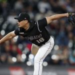 Colorado Rockies relief pitcher Seunghwan Oh works against the Arizona Diamondbacks during the sixth inning of a baseball game Wednesday, May 29, 2019, in Denver. (AP Photo/David Zalubowski)