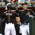 Arizona Diamondbacks' Jarrod Dyson (1) is congratulated by manager Torey Lovullo after scoring a run against the San Francisco Giants during the sixth inning of a baseball game Friday, May 17, 2019, in Phoenix. (AP Photo/Ralph Freso)