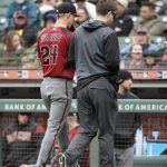 Arizona Diamondbacks pitcher Luke Weaver, left, walks off the field with a trainer during the sixth inning against the San Francisco Giants of a baseball game in San Francisco, Sunday, May 26, 2019. (AP Photo/Tony Avelar)