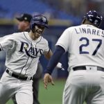 Tampa Bay Rays' Brandon Lowe, left, celebrates with third base coach Rodney Linares after his home run off Arizona Diamondbacks pitcher Taylor Clarke during the first inning of a baseball game, Tuesday, May 7, 2019, in St. Petersburg, Fla. (AP Photo/Chris O'Meara)