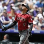 Arizona Diamondbacks' Eduardo Escobar gestures as he circles the bases after hitting a solo home run off Colorado Rockies starting pitcher German Marquez in the second inning of a baseball game Sunday, May 5, 2019, in Denver. (AP Photo/David Zalubowski)