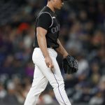 Colorado Rockies relief pitcher Seunghwan Oh walks on the mound after giving up a solo home run to Arizona Diamondbacks' Carson Kelly during the sixth inning of a baseball game Wednesday, May 29, 2019, in Denver. (AP Photo/David Zalubowski)