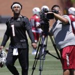 Arizona Cardinals' Kyler Murray (1) watches his teammates from the practice field during an NFL football practice, Wednesday, May 29, 2019, in Tempe, Ariz. (AP Photo/Matt York)