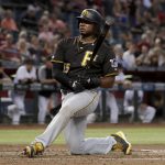 Pittsburgh Pirates' Josh Bell takes a knee after an inside pitch from the Arizona Diamondbacks during the third inning of a baseball game Tuesday, May 14, 2019, in Phoenix. (AP Photo/Matt York)