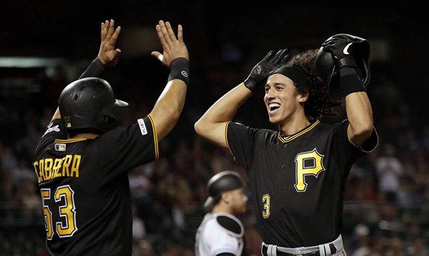 Pittsburgh Pirates' Cole Tucker celebrates his two-run home run with Melky Cabrera (53) during the ...