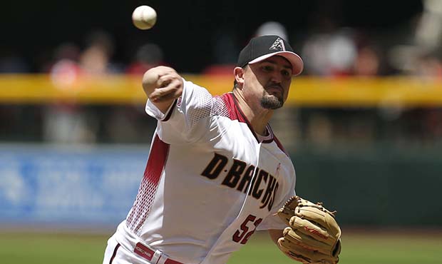 Arizona Diamondbacks pitcher Zack Godley throws against the Atlanta Braves in the first inning duri...