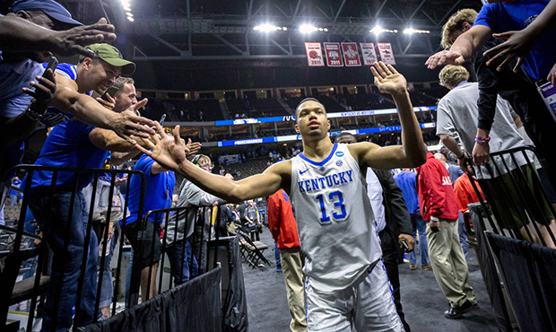 Kentucky's Jemarl Baker Jr. (13) is greeted by fans as he leaves the court after defeating Wofford ...