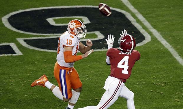 Alabama's Jerry Jeudy catches a touchdown pass in front of Clemson's Tanner Muse during the first h...