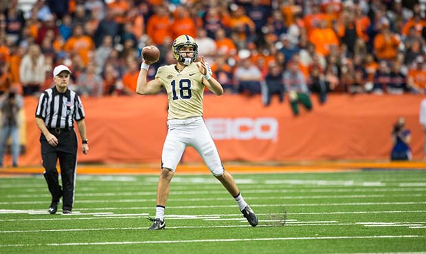 Ryan Winslow #18 of the Pittsburgh Panthers passes the ball on a fake punt during the fourth quarte...