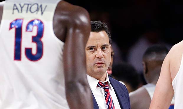 Head coach Sean Miller of the Arizona Wildcats talks with Deandre Ayton #13 during the first half o...