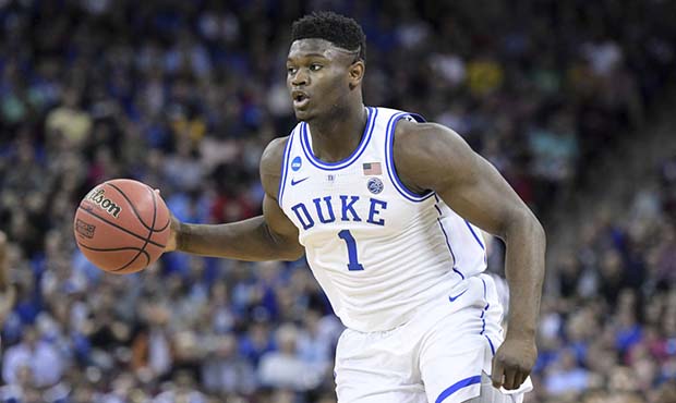 Duke forward Zion Williamson (1) dribbles the ball against Central Florida during the first half of...