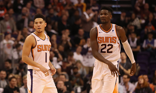 Devin Booker #1 and Deandre Ayton #22 of the Phoenix Suns during the NBA game against the Dallas Ma...