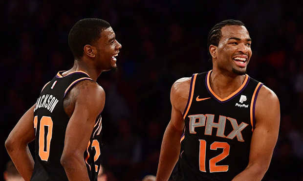 Josh Jackson #20 and T.J. Warren #12 of the Phoenix Suns react during the final minutes of the four...