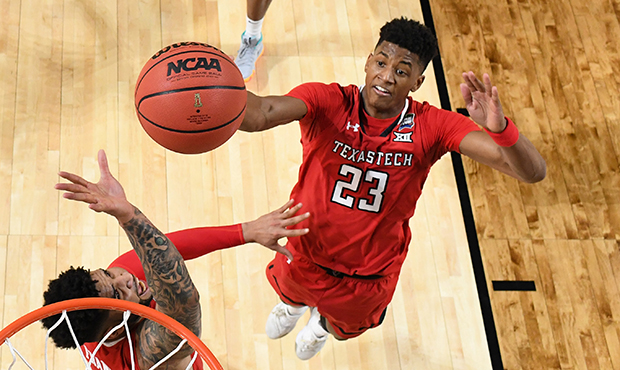 Jarrett Culver #23 of the Texas Tech Red Raiders shoots against the Virginia Cavaliers during the f...