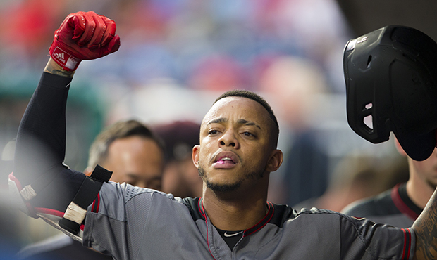 Ketel Marte #4 of the Arizona Diamondbacks reacts in the dugout after hitting a solo home run in th...