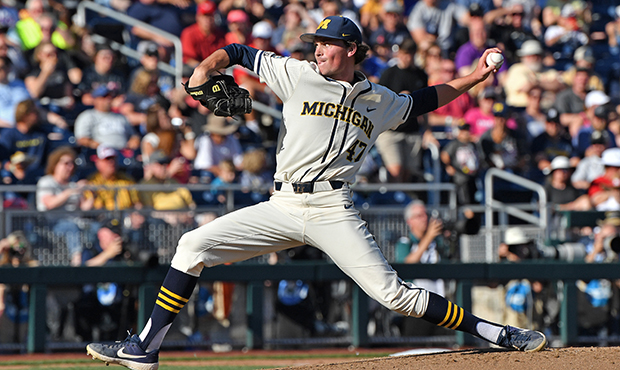 Pitcher Tommy Henry #47 of the Michigan Wolverines delivers a pitch in the first inning against the...