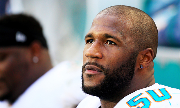 Andre Branch #50 of the Miami Dolphins looks on in the fourth quarter against the Tennessee Titans ...