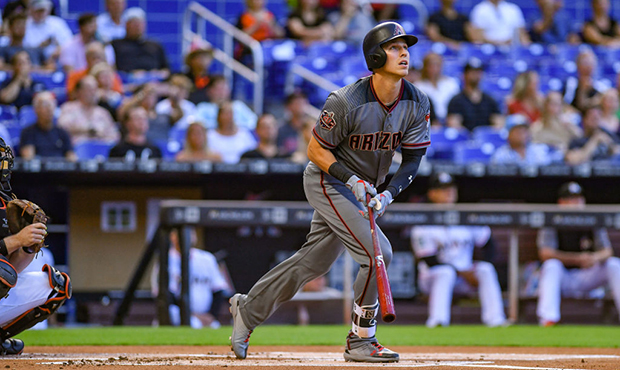 Jake Lamb #22 of the Arizona Diamondbacks hits a home run in the first inning during the game again...