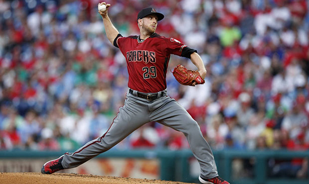 Arizona Diamondbacks' Merrill Kelly pitches during the third inning of a baseball game against the ...