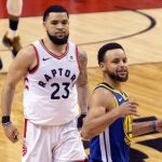 Golden State Warriors' Stephen Curry, right, celebrates in front of Toronto Raptors' Fred VanVleet at the final buzzer as the Warriors beat the Raptors 106-105 in Game 5 of the NBA Finals in Toronto on Monday, June 10, 2019. (Chris Young/The Canadian Press via AP)