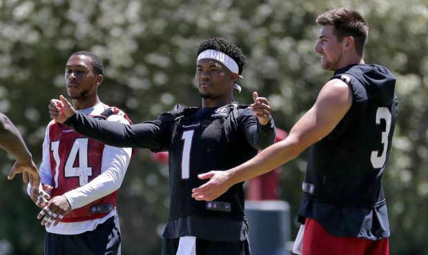 Arizona Cardinals' Kyler Murray (1), Drew Anderson (3) and Damiere Byrd (14) stretch during an NFL ...