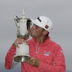 Gary Woodland posses with the trophy after winning the U.S. Open Championship golf tournament Sunday, June 16, 2019, in Pebble Beach, Calif. (AP Photo/Matt York)