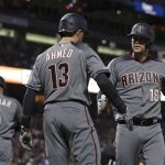 Arizona Diamondbacks' Carson Kelly, right, celebrates with Nick Ahmed (13) after hitting a two run home run off San Francisco Giants' Trevor Gott during the seventh inning of a baseball game Thursday, June 27, 2019, in San Francisco. (AP Photo/Ben Margot)