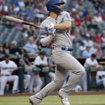 Los Angeles Dodgers' Joc Pederson follows through on a base hit against the Arizona Diamondbacks during the first inning of a baseball game, Tuesday, June 4, 2019, in Phoenix. (AP Photo/Matt York)