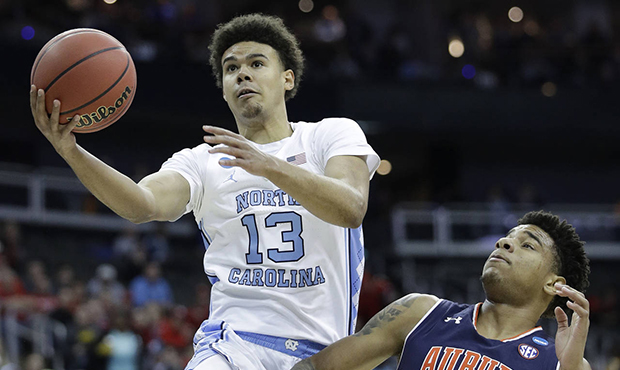 FILE - In this March 29, 2019, file photo, North Carolina's Cameron Johnson (13) heads to the baske...