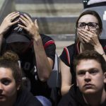 Toronto Raptors fans react during the last seconds of Game 5 of the NBA Final between the Toronto Raptors and Golden State Warriors on a big screen inside the Leon's Centre in Kingston, Ontario, on Monday June 10, 2019. (Lars Hagberg/The Canadian Press via AP)