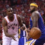 Toronto Raptors center Serge Ibaka (9) loses control of the ball by Golden State Warriors center DeMarcus Cousins (0) during second-half basketball action in Game 5 of the NBA Finals in Toronto, Monday, June 10, 2019. (Frank Gunn/The Canadian Press via AP)