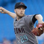 Arizona Diamondbacks starting pitcher Merrill Kelly throws against the Toronto Blue Jays in a baseball game Friday, June 7, 2019, in Toronto. (Fred Thornhill/The Canadian Press via AP)